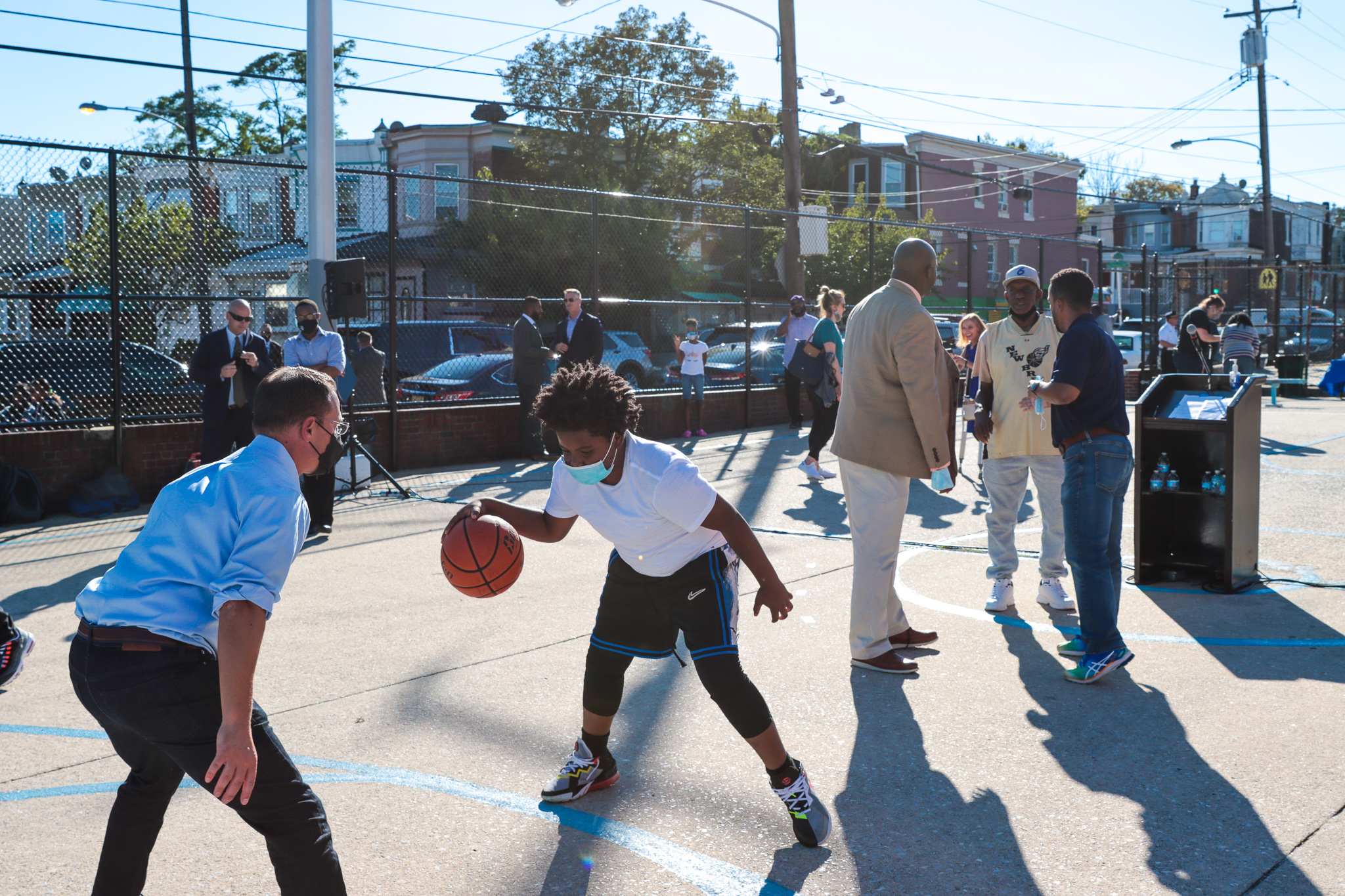 Josh playing basketball with a kid